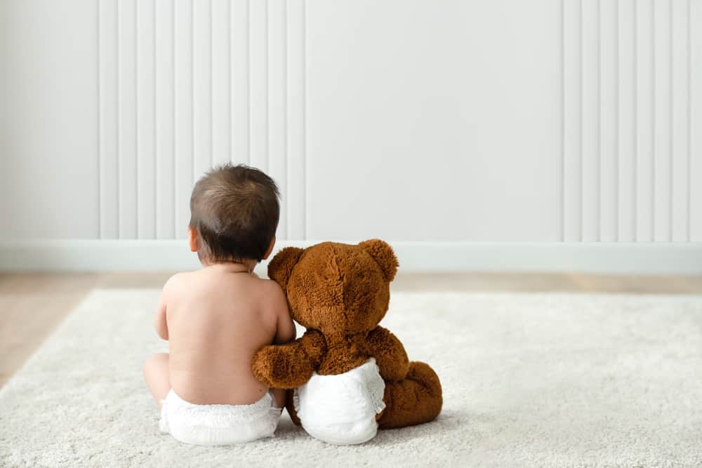 Illustration of diverse babies with playful typography showing trending baby names like River, Amara, Eleanor, and Rowan for 2025